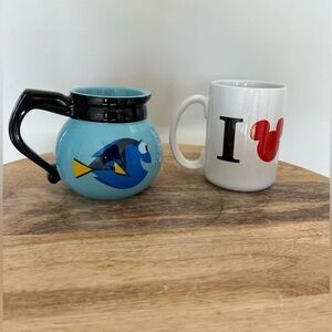 Set of Disney Mugs. Dori Coffee pot mug and I LOVE N.Y. Mug.In great condition!